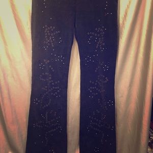 Black corduroy jeans with studs and grommets